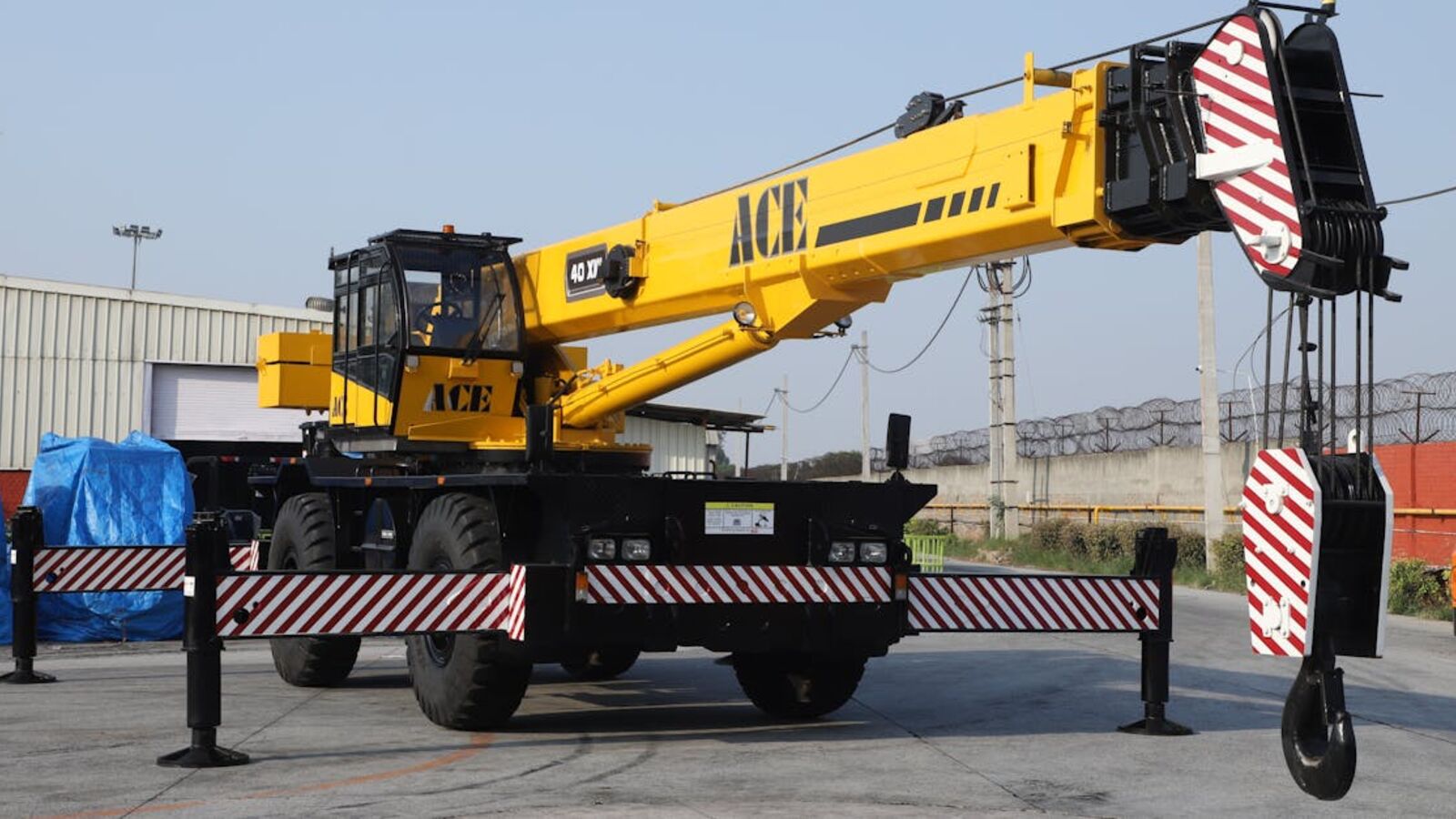 A 40 ton ACE rough terrain crane parked outdoors in an industrial yard in Faridabad, India.